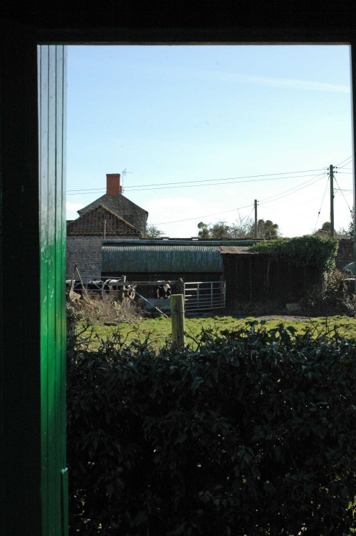 View through church door to the adjacent farm